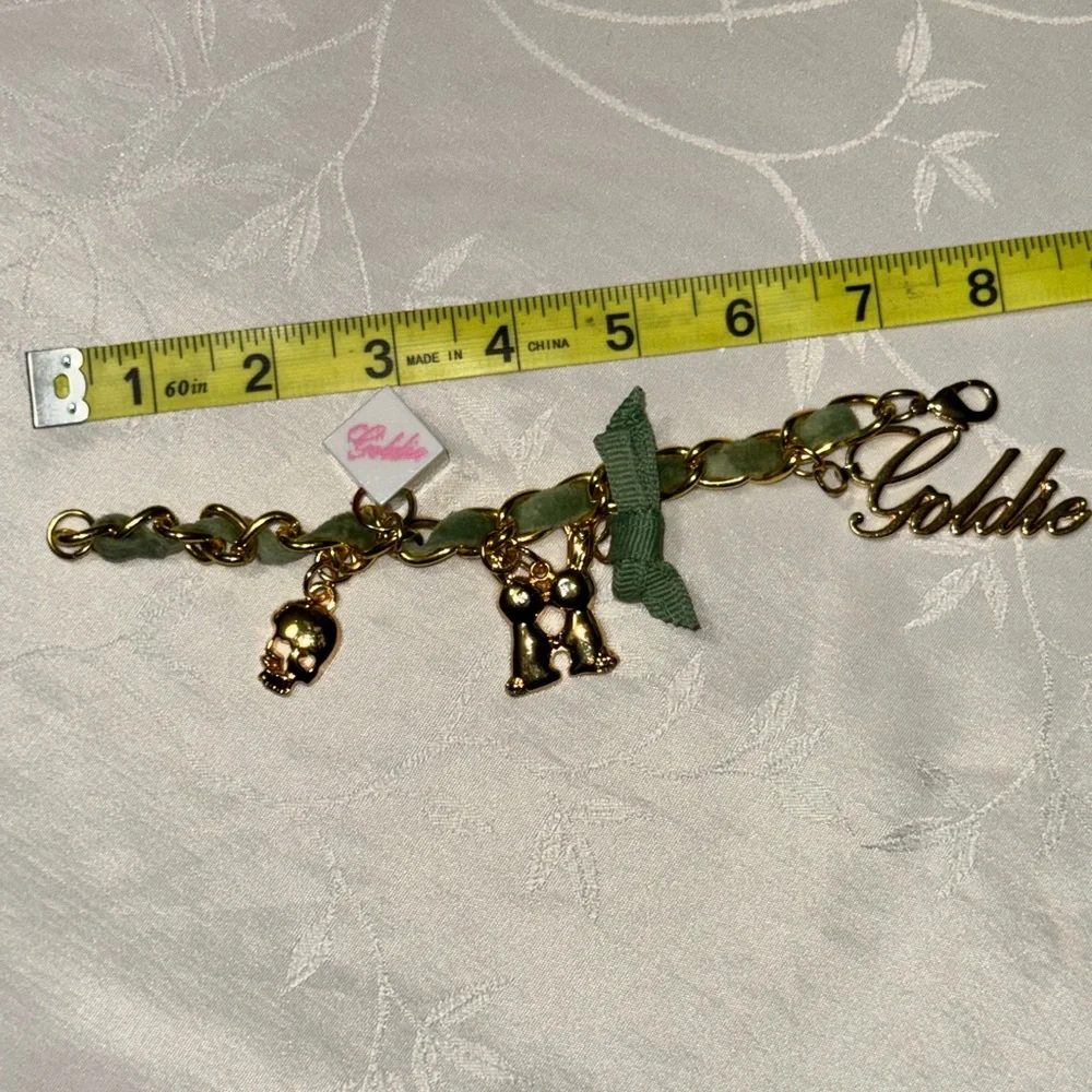 Goldie gold tone